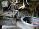 1982 Nissan Titan - Close-up view of a truck's suspension and rear axle components during repair work.
