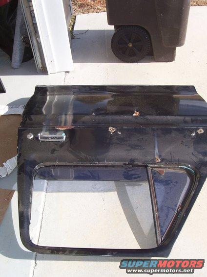 picture-008-door.jpg Got this intact door from a junkyard for $75. It was in much better shape than mine. It had slight surface and a few dents but the bottoms weren't rusted out. 