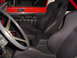 1989 Jeep YJ - The interior of a 1989 Jeep YJ shows racing seats and a roll cage, suggesting off-road modifications.