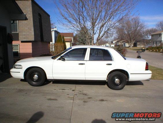 White 2000 Ford Crown Victoria sedan, side view