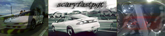 White coupe with yellow and black striped markings on the front fender, seen from a 3/4 front angle