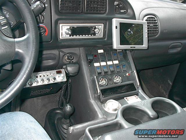 2001 Dodge 1500 interior showing dashboard, steering wheel, CB radio, and monitor