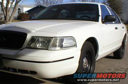 White 2000 Ford Crown Victoria parked outside