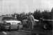 1999 Mercury Grand Marquis - A police car, tow truck, and another vehicle are at a roadside scene, with officers present.