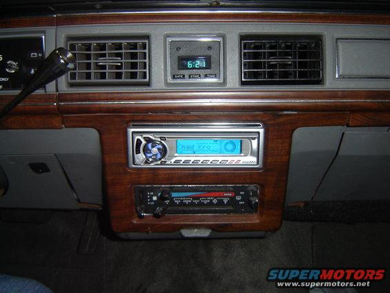 Dashboard with aftermarket stereo and digital clock