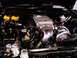 1986 Ford Bronco - Custom engine bay a large turbocharger and polished intake components.