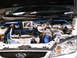 1986 Ford Bronco - Modified engine bay with twin turbochargers and custom blue piping.