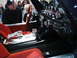 1986 Ford Bronco - Interior view of a custom vehicle red seats, a chrome shifter, and a dashboard with five prominent gauges.