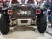 1986 Ford Bronco - This custom Jeep features prominent "JEEP" badging on its rear panel and oversized off-road tires.