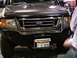 1986 Ford Bronco - Front view of a Ford E-Series van with a custom bumper and grille.