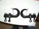 1985 Ford Bronco II - Two black tow hooks are shown, each with two bolts and nuts for attachment.