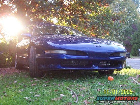 Blue 1994 Ford Probe front view parked on grass