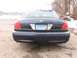 1999 Ford Crown Victoria - Rear view of a dark blue Ford Crown Victoria parked outdoors in winter.