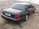 1999 Ford Crown Victoria - Rear view of a dark blue 1999 Ford Crown Victoria parked on pavement.