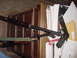 1969 Ford Bronco - A handgun and rifle are placed on top of a wooden cabinet next to a pile of documents.