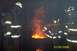 1998 Ford Crown Victoria - Firefighters observe a fire, with sparks rising from the flames. The date 01/05/2006 is visible.