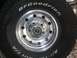 1990 Ford Bronco - Close-up of a BFGoodrich All-Terrain T/A tire mounted on a shiny chrome wheel.