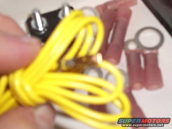Close-up of yellow wire and red electrical connectors