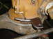 1982 Nissan Titan - Close-up of a differential housing with a metal bracket attached. Watermark reads 'Supermotors.net'.