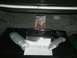 1992 Ford Crown Victoria - A car audio amplifier and related parts are laid out in what appears to be a vehicle's trunk.