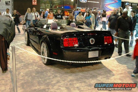 Black convertible with GT badge, rear view
