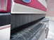 1993 Ford Bronco - Detail shot of the rear bumper and lower tailgate of a truck, showing wear and dirt.