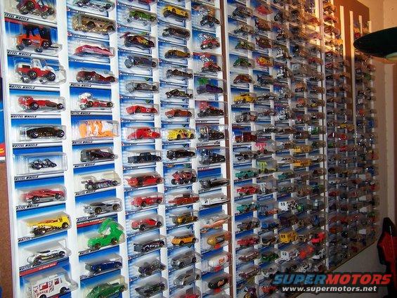 Wall of packaged Hot Wheels toy cars