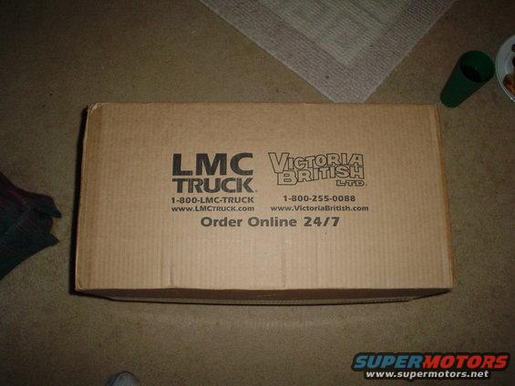 Cardboard box with LMC Truck and Victoria British Ltd. logos, phone numbers, and website addresses