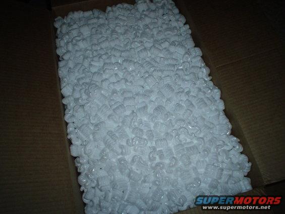 Box filled with white packing peanuts