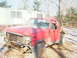 1984 Ford Bronco - This red Ford Bronco appears to be from the early 1980s, with significant damage and missing components.