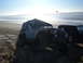 1985 Ford Ranger - Two off-road vehicles on a sandy beach with the ocean in the background.