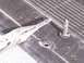 1978 Ford Bronco - A pair of pliers is used to remove a plastic fastener from a textured surface, possibly interior trim.