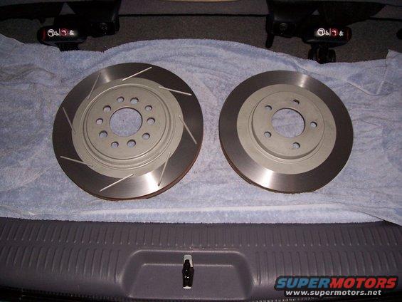 Two slotted brake rotors on a towel