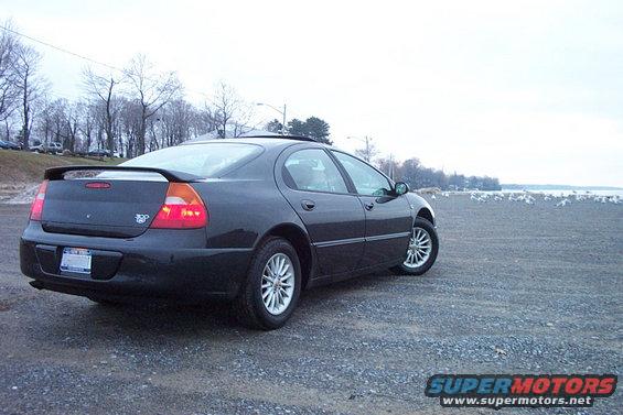 1999 Chrysler 300M parked on gravel with water and birds in the background