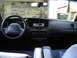 2000 Ford Crown Victoria - The interior of a 2000 Ford Crown Victoria is visible, including the dashboard and seats.