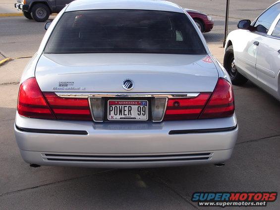 Silver 2000 Ford Crown Victoria Grand Marquis LS rear view with Nebraska license plate "POWER 99"