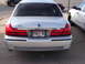 2000 Ford Crown Victoria - Rear view of a silver 2000 Ford Crown Victoria Grand Marquis LS, showing its taillights and license plate.