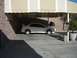 1996 Ford Probe - A silver Dodge Neon SRT-4 is parked under a beige and white striped awning.