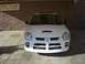 1996 Ford Probe - Front view of a white Dodge Neon SRT-4 parked indoors.