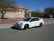 1996 Ford Probe - A white Dodge Neon SRT-4 is parked on the street in front of a house on a sunny day.