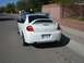 1996 Ford Probe - Rear view of a white Dodge SRT-4 parked on a residential street.