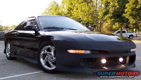 100_1416.jpg front view, body kit painted primer black for now.