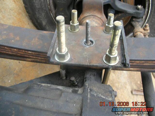 truck-012.jpg The new spring plate...Cut it out from 1/4" plate and then cut two 1 1/2" strips to across the ends to keep it from pulling down. This is the only thing I welded myself..You can tell it too