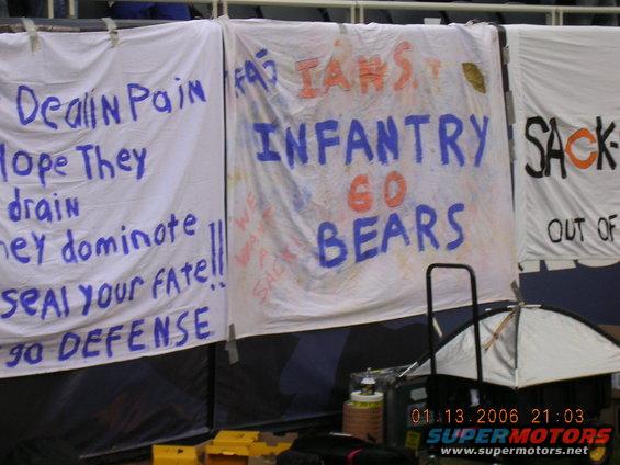 Banners with sports slogans like 'Dealin Pain', 'Infantry Go Bears', and 'Sack-Out'
