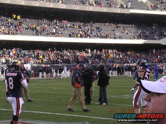 Football players on field, crowd in stadium stands. Date stamp reads 01.13.2008