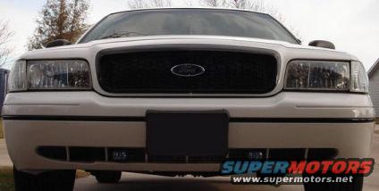 White 2000 Ford Crown Victoria front view with black grille and license plate