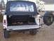 1974 Ford Bronco - This classic SUV features a rear-mounted spare tire and a drop-down tailgate for easy cargo access.