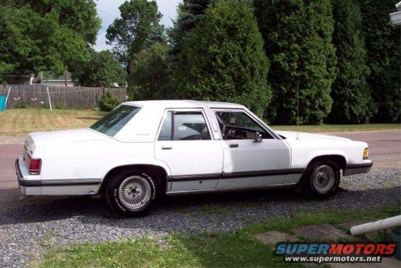 White 1988 Mercury Grand Marquis sedan, side view