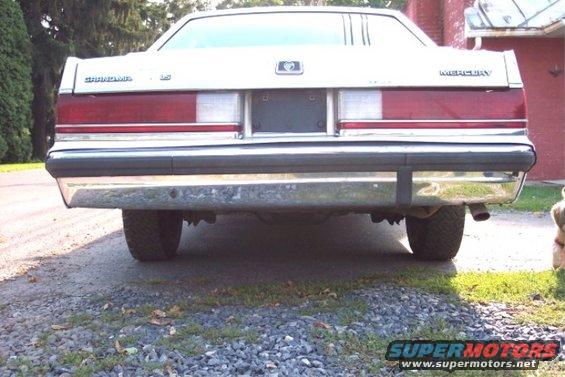 Rear view of a white 1988 Mercury Grand Marquis with chrome bumper and taillights