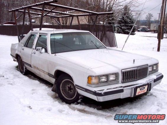 White 1988 Mercury Grand Marquis in snow, 3q-front view